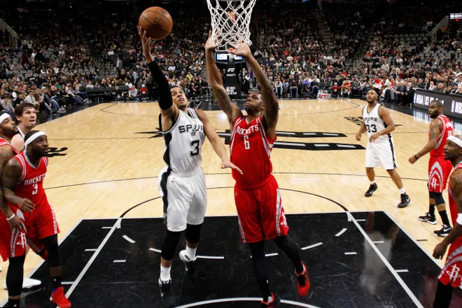 Jan 27, 2016; San Antonio, TX, USA; San Antonio Spurs point guard Ray McCallum (3) shoots the ball as Houston Rockets power forward Terrence Jones (6) defends during the second half at AT&T Center. Mandatory Credit: Soobum Im-USA TODAY Sports