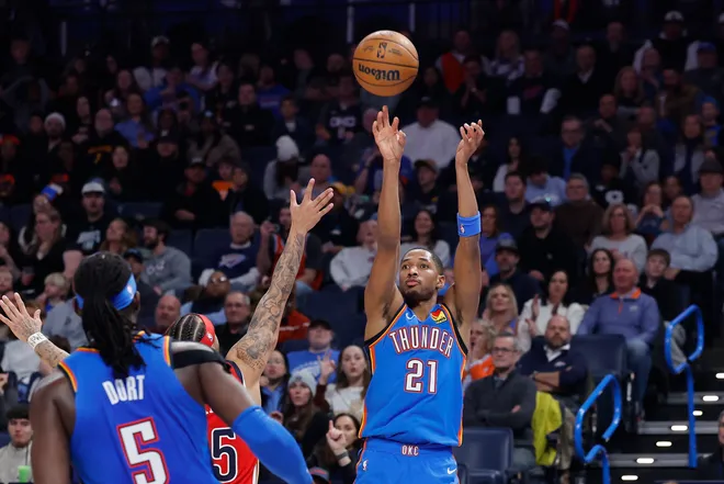 Jan 27, 2026; Oklahoma City, Oklahoma, USA; Oklahoma City Thunder guard Aaron Wiggins (21) shoots a three point basket against the New Orleans Pelicans during the second half at Paycom Center. Mandatory Credit: Alonzo Adams-Imagn Images