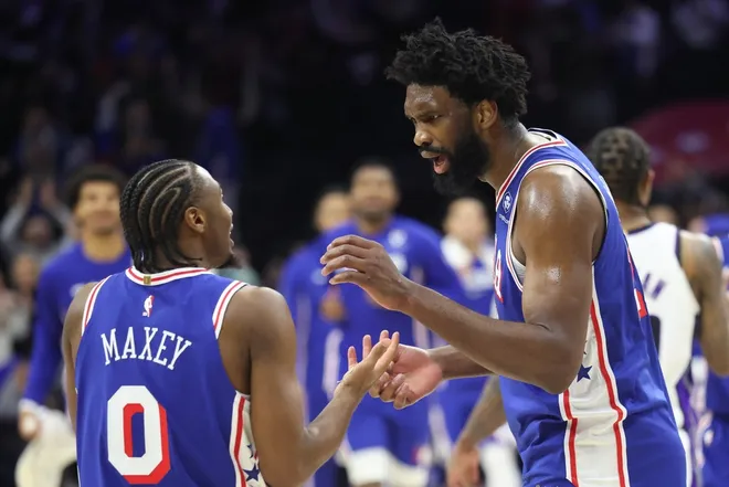 Jan 29, 2026; Philadelphia, Pennsylvania, USA; Philadelphia 76ers center Joel Embiid (21) reacts with Philadelphia 76ers guard Tyrese Maxey (L) after a victory against the Sacramento Kings at Xfinity Mobile Arena.