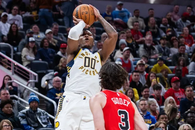 Jan 28, 2026; Indianapolis, Indiana, USA; Indiana Pacers guard/forward Bennedict Mathurin (00) shoots the ball while Chicago Bulls guard Josh Giddey (3) defends in the second half at Gainbridge Fieldhouse.