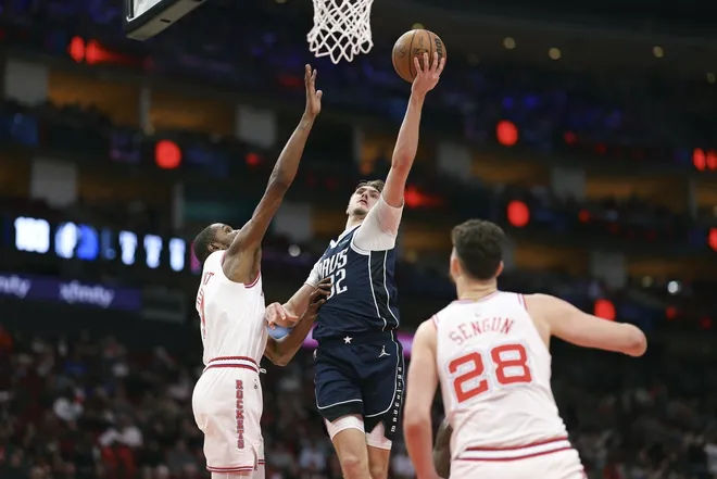 Jan 31, 2026; Houston, Texas, USA; Dallas Mavericks forward Cooper Flagg (32) shoots the ball as Houston Rockets forward Kevin Durant (7) defends during the fourth quarter at Toyota Center.