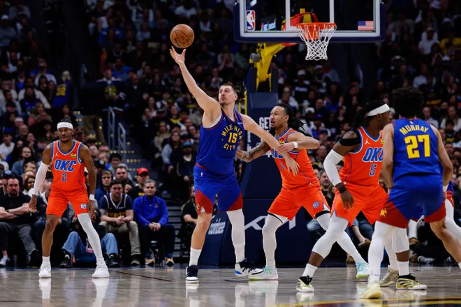 Feb 1, 2026; Denver, Colorado, USA; Denver Nuggets center Nikola Jokic (15) grabs a pass as Oklahoma City Thunder forward Jaylin Williams (6) guards in the second quarter at Ball Arena. Mandatory Credit: Isaiah J. Downing-Imagn Images