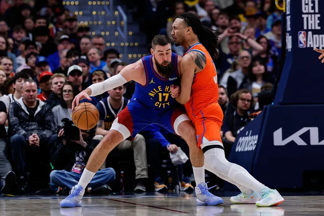 Feb 1, 2026; Denver, Colorado, USA; Denver Nuggets center Jonas Valanciunas (17) controls the ball as Oklahoma City Thunder forward Jaylin Williams (6) guards in the second quarter at Ball Arena. Mandatory Credit: Isaiah J. Downing-Imagn Images