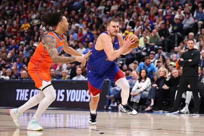 DENVER, COLORADO - FEBRUARY 01: Nikola Jokic #15 of the Denver Nuggets drives to the basket against Jaylin Williams #6 of the Oklahoma City Thunder during the first quarter at Ball Arena on February 1, 2026 in Denver, Colorado. NOTE TO USER: User expressly acknowledges and agrees that, by downloading and or using this photograph, User is consenting to the terms and conditions of the Getty Images License Agreement. (Photo by Justin Tafoya/Getty Images)