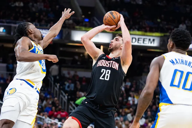 Feb 2, 2026; Indianapolis, Indiana, USA; Houston Rockets center Alperen Sengun (28) shoots the ball while Indiana Pacers guard/forward Aaron Nesmith (23) defends in the first half at Gainbridge Fieldhouse. Mandatory Credit: Trevor Ruszkowski-Imagn Images