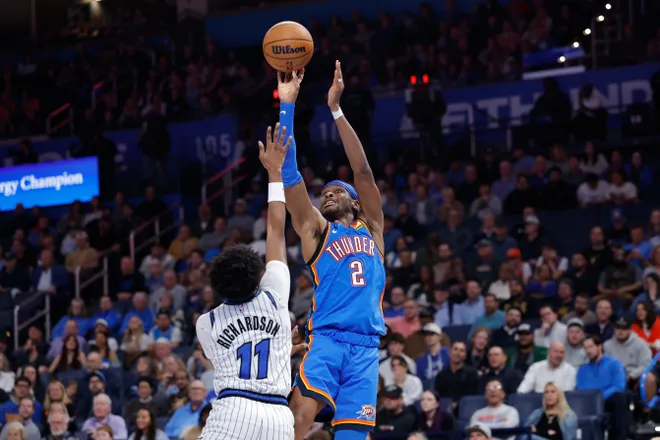 Feb 3, 2026; Oklahoma City, Oklahoma, USA; Oklahoma City Thunder guard Shai Gilgeous-Alexander (2) shoots over Orlando Magic guard Jase Richardson (11) during the second half at Paycom Center. Mandatory Credit: Alonzo Adams-Imagn Images