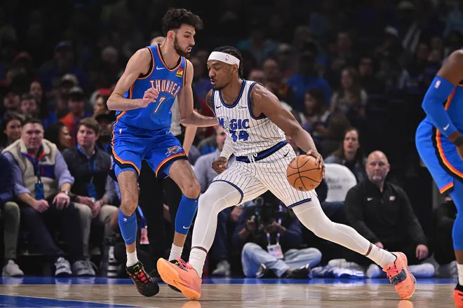 OKLAHOMA CITY, OKLAHOMA - FEBRUARY 3: Wendell Carter Jr. #34 of the Orlando Magic attempts to drive the ball past Chet Holmgren #7 of the Oklahoma City Thunder during the first half at Paycom Center on February 3, 2026 in Oklahoma City, Oklahoma. NOTE TO USER: User expressly acknowledges and agrees that, by downloading and or using this photograph, User is consenting to the terms and conditions of the Getty Images License Agreement. (Photo by Joshua Gateley/Getty Images)