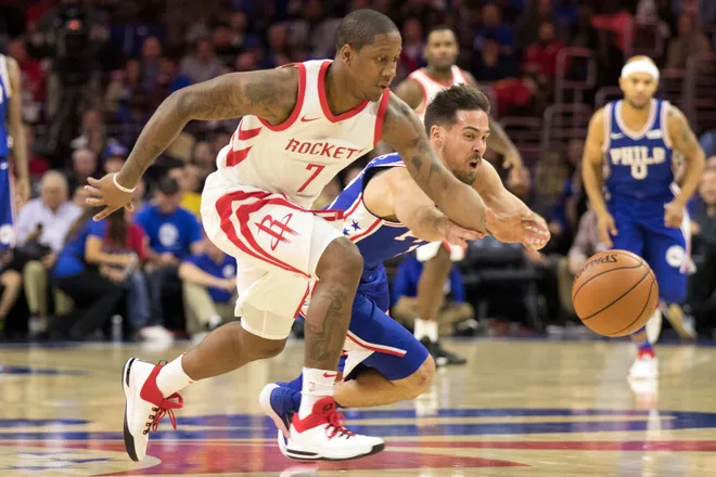 Oct 25, 2017; Philadelphia, PA, USA; Philadelphia 76ers guard T.J. McConnell (12) dives in an attempt to steal the ball from Houston Rockets point guard Isaiah Canaan (7) during the first quarter at Wells Fargo Center. Mandatory Credit: Bill Streicher-USA TODAY Sports