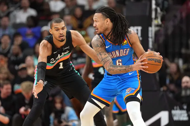 Feb 4, 2026; San Antonio, Texas, USA; San Antonio Spurs forward Victor Wembanyama (1) defends against Oklahoma City Thunder forward Jaylin Williams (6) during the first half at Frost Bank Center. Mandatory Credit: Scott Wachter-Imagn Images