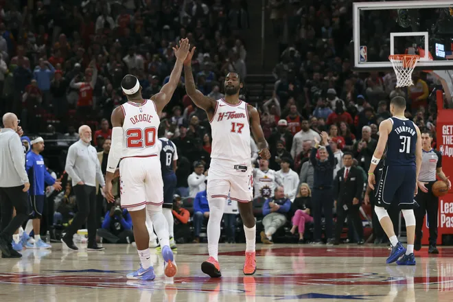 Jan 31, 2026; Houston, Texas, USA; Houston Rockets forward Tari Eason (17) celebrates with guard Josh Okogie (20) after a play during the fourth quarter against the Dallas Mavericks at Toyota Center. Mandatory Credit: Troy Taormina-Imagn Images