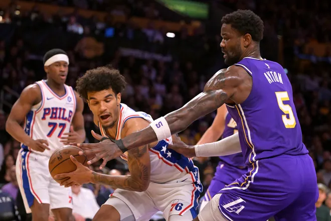 Feb 5, 2026; Los Angeles, California, USA; Philadelphia 76ers forward Dominick Barlow (25) is defended by Los Angeles Lakers center Deandre Ayton (5) in the first half at Crypto.com Arena. Mandatory Credit: Jayne Kamin-Oncea-Imagn Images