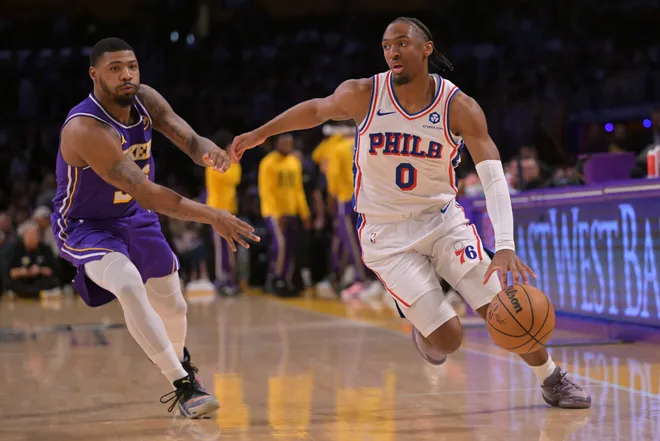 Feb 5, 2026; Los Angeles, California, USA; Philadelphia 76ers guard Tyrese Maxey (0) is defended by Los Angeles Lakers guard Marcus Smart (36) as he drives to the basket in the first half at Crypto.com Arena. Mandatory Credit: Jayne Kamin-Oncea-Imagn Images