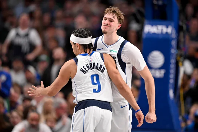 Feb 5, 2026; Dallas, Texas, USA; Dallas Mavericks forward Cooper Flagg (32) and guard Ryan Nembhard (9) celebrates during the second half \S| at the American Airlines Center. Mandatory Credit: Jerome Miron-Imagn Images