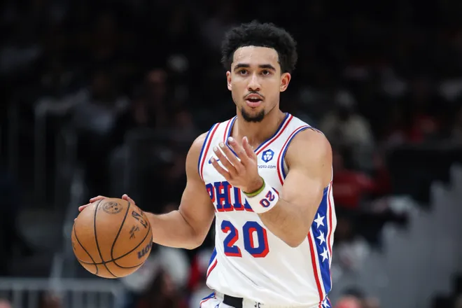 Dec 14, 2025; Atlanta, Georgia, USA; Philadelphia 76ers guard Jared McCain (20) dribbles and signals to teammates during the game against the Atlanta Hawks in the first quarter at State Farm Arena. Mandatory Credit: Jordan Godfree-Imagn Images