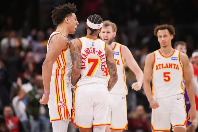 Feb 5, 2026; Atlanta, Georgia, USA; Atlanta Hawks guard Nickeil Alexander-Walker (7) celebrates with forward Jalen Johnson (1) and center Jock Landale (31) and guard Dyson Daniels (5) after a go-ahead basket against the Utah Jazz in the fourth quarter at State Farm Arena.