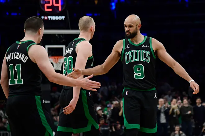 Feb 6, 2026; Boston, Massachusetts, USA; Boston Celtics guard Derrick White (9) congratulates guard Payton Pritchard (11) after making a basket during the second half against the Miami Heat at TD Garden. Mandatory Credit: Bob DeChiara-Imagn Images