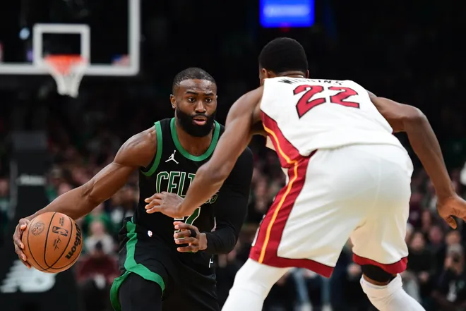 Feb 6, 2026; Boston, Massachusetts, USA; Boston Celtics guard Jaylen Brown (7) controls the ball while Miami Heat forward Andrew Wiggins (22) defends during the second half at TD Garden. Mandatory Credit: Bob DeChiara-Imagn Images