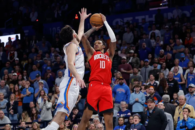 Feb 7, 2026; Oklahoma City, Oklahoma, USA; Houston Rockets forward Jabari Smith Jr. (10) shoots as Oklahoma City Thunder center/forward Chet Holmgren (7) defends during the second half at Paycom Center. Mandatory Credit: Alonzo Adams-Imagn Images
