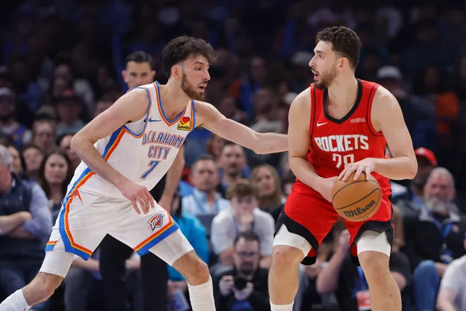 Feb 7, 2026; Oklahoma City, Oklahoma, USA; Oklahoma City Thunder center/forward Chet Holmgren (7) defends a drive by Houston Rockets center Alperen Sengun (28) during the first half at Paycom Center. Mandatory Credit: Alonzo Adams-Imagn Images