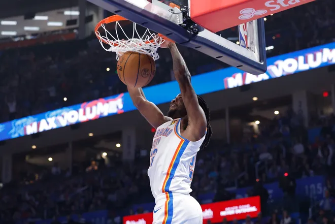 Feb 7, 2026; Oklahoma City, Oklahoma, USA; Oklahoma City Thunder guard Cason Wallace (22) dunks against the Houston Rockets during the first half at Paycom Center. Mandatory Credit: Alonzo Adams-Imagn Images