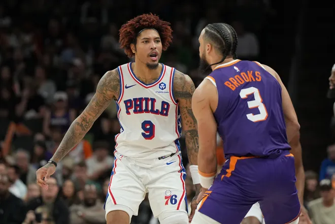 Feb 7, 2026; Phoenix, Arizona, USA; Philadelphia 76ers guard Kelly Oubre Jr. (9) and Phoenix Suns forward Dillon Brooks (3) talk to each other during the second half of an NBA game at Mortgage Matchup Center. Mandatory Credit: Rick Scuteri-Imagn Images