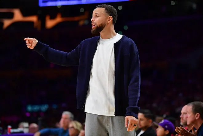 Feb 7, 2026; Los Angeles, California, USA; Golden State Warriors guard Stephen Curry (30) watches game action during the second half at Crypto.com Arena.