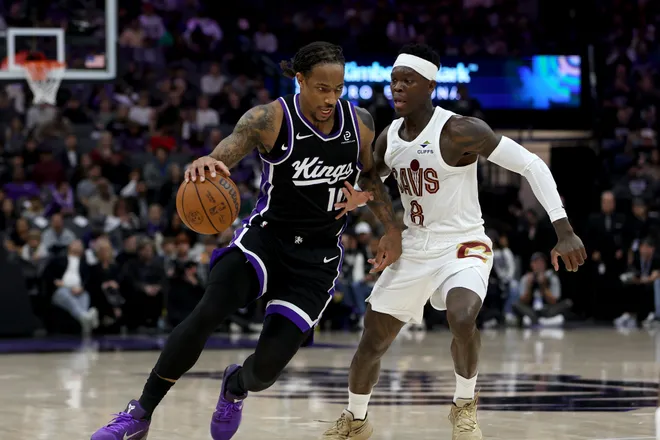 Feb 7, 2026; Sacramento, California, USA; Sacramento Kings forward DeMar DeRozan (10) dribbles around Cleveland Cavaliers guard Dennis Schroder (8) during the second quarter at Golden 1 Center. Mandatory Credit: Dennis Lee-Imagn Images