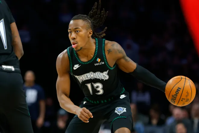 Feb 8, 2026; Minneapolis, Minnesota, USA; Minnesota Timberwolves guard Ayo Dosunmu (13) brings the ball up court against the Los Angeles Clippers in the first quarter at Target Center. Mandatory Credit: Bruce Kluckhohn-Imagn Images