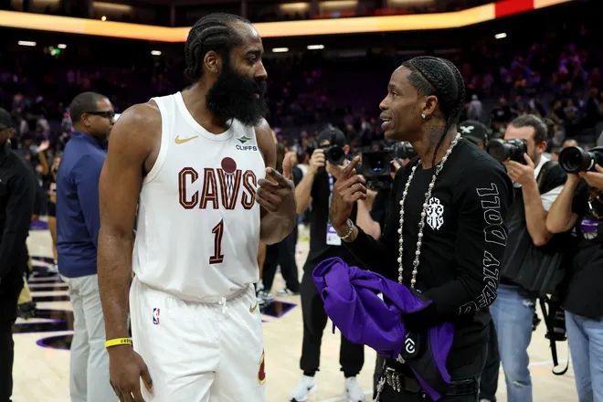 Feb 7, 2026; Sacramento, California, USA; Cleveland Cavaliers guard James Harden (1) talks with rapper Travis Scott after a game against the Sacramento Kings at Golden 1 Center. Mandatory Credit: Dennis Lee-Imagn Images