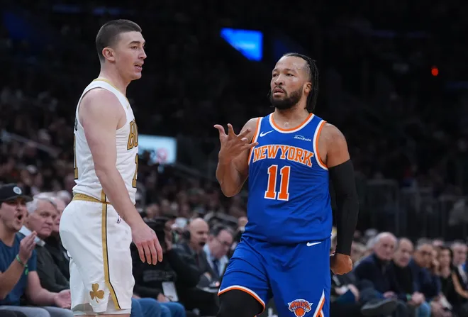 Feb 8, 2026; Boston, Massachusetts, USA; New York Knicks guard Jalen Brunson (11) reacts after his three point basket against Boston Celtics guard Payton Pritchard (11) in the first quarter at TD Garden. Mandatory Credit: David Butler II-Imagn Images