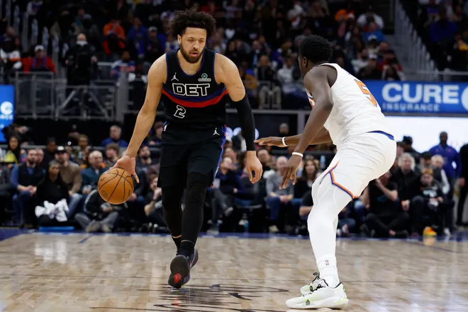 Feb 6, 2026; Detroit, Michigan, USA; Detroit Pistons guard Cade Cunningham (2) dribbles defended by New York Knicks forward Mohamed Diawara (51) in the second half at Little Caesars Arena. Mandatory Credit: Rick Osentoski-Imagn Images