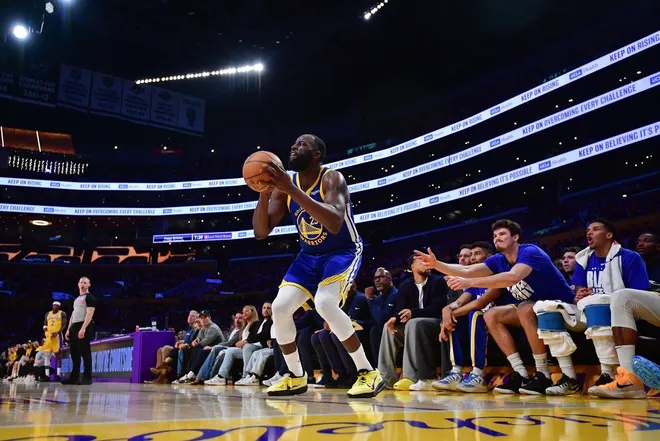 Feb 7, 2026; Los Angeles, California, USA; Golden State Warriors forward Draymond Green (23) shoots against the Los Angeles Lakers during the second half at Crypto.com Arena.