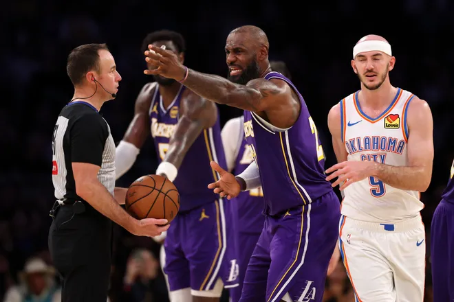 Feb 9, 2026; Los Angeles, California, USA; Los Angeles Lakers forward LeBron James (23) argues with referee Josh Tiven (58) during the fourth quarter against the Oklahoma City Thunder at Crypto.com Arena. Mandatory Credit: Kiyoshi Mio-Imagn Images