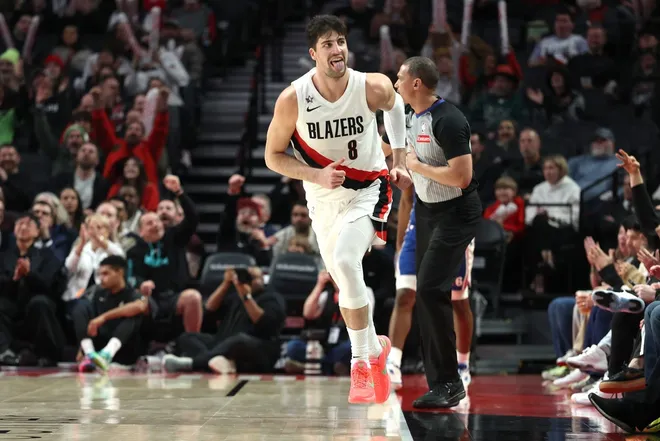 Feb 9, 2026; Portland, Oregon, USA; Portland Trail Blazers forward Deni Avdija (8) reacts after scoring against the Philadelphia 76ers during the second half at Moda Center.