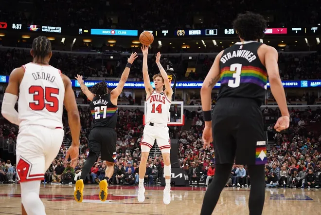 Feb 7, 2026; Chicago, Illinois, USA; Chicago Bulls forward Matas Buzelis (14) shoots over Denver Nuggets guard Jamal Murray (27) during the second half at United Center.