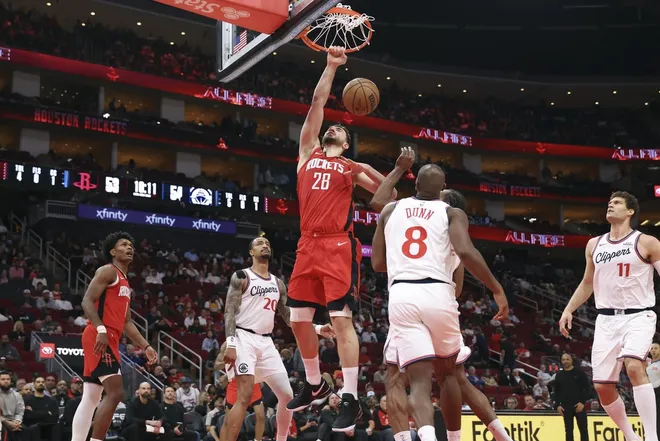 Feb 10, 2026; Houston, Texas, USA; Houston Rockets center Alperen Sengun (28) dunks the ball during the third quarter against the Los Angeles Clippers at Toyota Center.