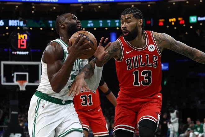 Feb 11, 2026; Boston, Massachusetts, USA; Chicago Bulls center Nick Richards (13) fouls Boston Celtics guard Jaylen Brown (7) during the first quarter at TD Garden. Mandatory Credit: Winslow Townson-Imagn Images