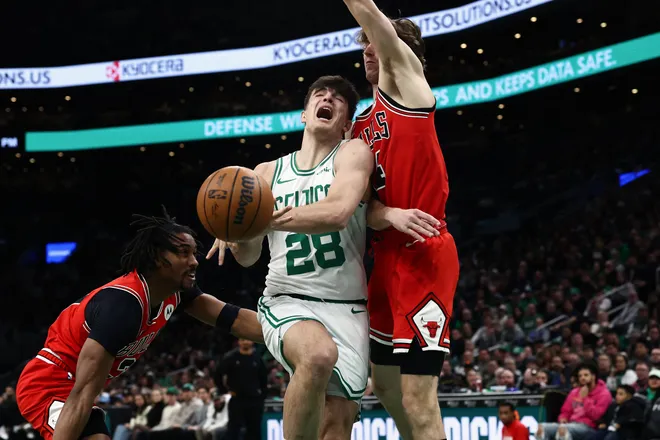 Feb 11, 2026; Boston, Massachusetts, USA; Boston Celtics guard Hugo Gonzalez (28) loses the ball driving on Chicago Bulls forward Matas Buzelis (14) during the first quarter at TD Garden. Mandatory Credit: Winslow Townson-Imagn Images