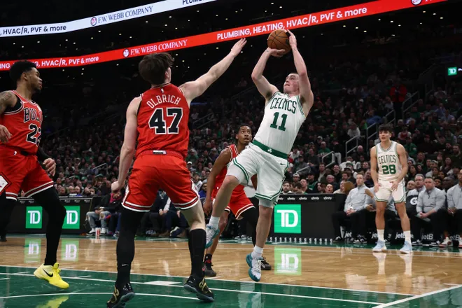 Feb 11, 2026; Boston, Massachusetts, USA; Boston Celtics guard Payton Pritchard (11) shoots over Chicago Bulls center Lachlan Olbrich (47) during the second quarter at TD Garden. Mandatory Credit: Winslow Townson-Imagn Images