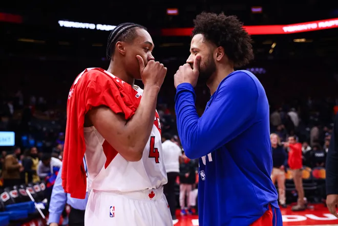 Scottie Barnes #4 of the Raptors talks with Cade Cunningham of the Pistons talk after their NBA game at Scotiabank Arena.