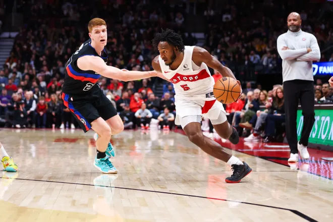 Immanuel Quickley #5 of the Raptors drives around Kevin Huerter #27 of the Pistons during the second half at Scotiabank Arena.