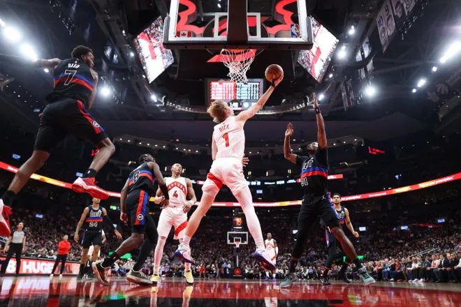 Gradey Dick #1 of the Raptors puts up a shot against Javonte Green #31 of the Pistons during the second half at Scotiabank Arena.