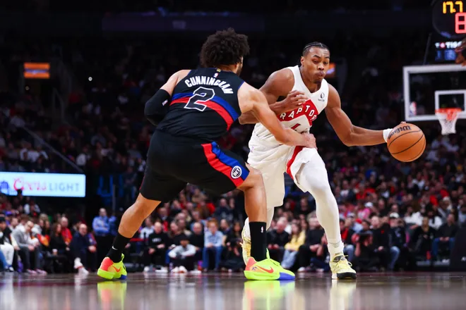 Scottie Barnes #4 of the Raptors drives against Cade Cunningham #2 of the Pistons during the second half.