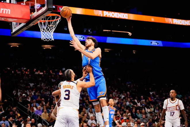 Feb 11, 2026; Phoenix, Arizona, USA; Oklahoma City Thunder center/forward Chet Holmgren (7) goes up against Phoenix Suns guard/forward Dillon Brooks (3) during the second half of the game at Mortgage Matchup Center. Mandatory Credit: Arianna Grainey-Imagn Images