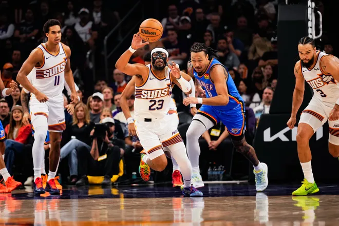 Feb 11, 2026; Phoenix, Arizona, USA; Phoenix Suns guard Jordan Goodwin (23) grabs the ball during the first half of the game at Mortgage Matchup Center. Mandatory Credit: Arianna Grainey-Imagn Images