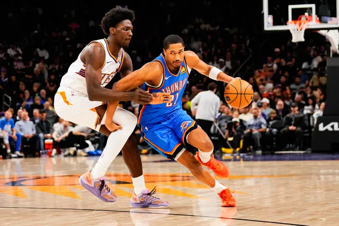 Feb 11, 2026; Phoenix, Arizona, USA; Oklahoma City Thunder guard Aaron Wiggins (21) dribbles during the second half of the game at Mortgage Matchup Center. Mandatory Credit: Arianna Grainey-Imagn Images