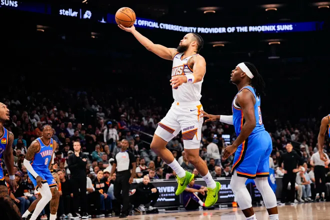 Feb 11, 2026; Phoenix, Arizona, USA; Phoenix Suns guard/forward Dillon Brooks (3) goes for a shot against Oklahoma City Thunder guard Luguentz Dort (5)during the first half of the game at Mortgage Matchup Center. Mandatory Credit: Arianna Grainey-Imagn Images