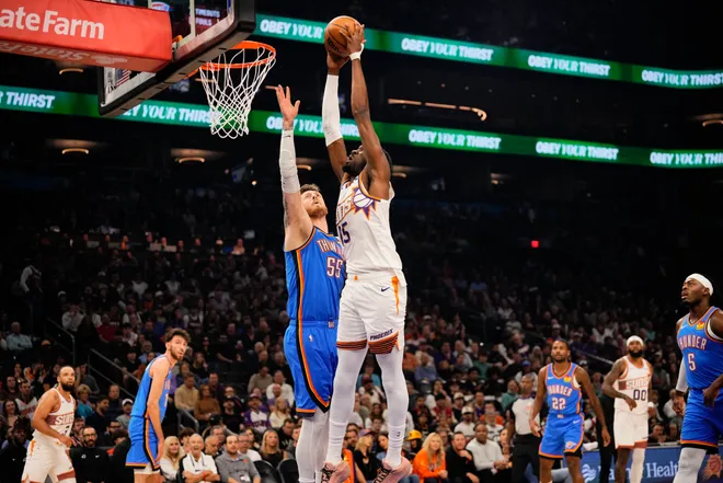 Feb 11, 2026; Phoenix, Arizona, USA; Phoenix Suns center Mark Williams (15) goes for a shot against Oklahoma City Thunder center/forward Isaiah Hartenstein (55) during the first half of the game at Mortgage Matchup Center. Mandatory Credit: Arianna Grainey-Imagn Images
