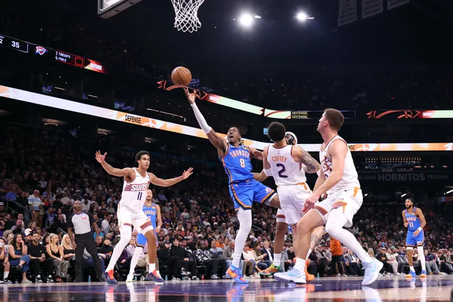 PHOENIX, ARIZONA - FEBRUARY 11: Jalen Williams #8 of the Oklahoma City Thunder shoots the ball against Amir Coffey #2 of the Phoenix Suns during the first half at Mortgage Matchup Center on February 11, 2026 in Phoenix, Arizona. NOTE TO USER: User expressly acknowledges and agrees that, by downloading and or using this photograph, User is consenting to the terms and conditions of the Getty Images License Agreement. (Photo by Chris Coduto/Getty Images)