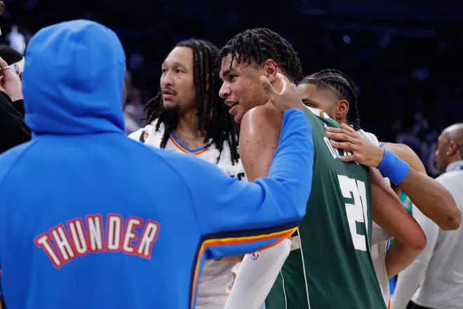 Feb 12, 2026; Oklahoma City, Oklahoma, USA; Milwaukee Bucks forward Ousmane Dieng (21) meets with his former Oklahoma City Thunder players after their game at Paycom Center. Mandatory Credit: Alonzo Adams-Imagn Images